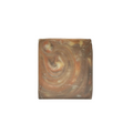 Square soap with swirling pattern on a white background