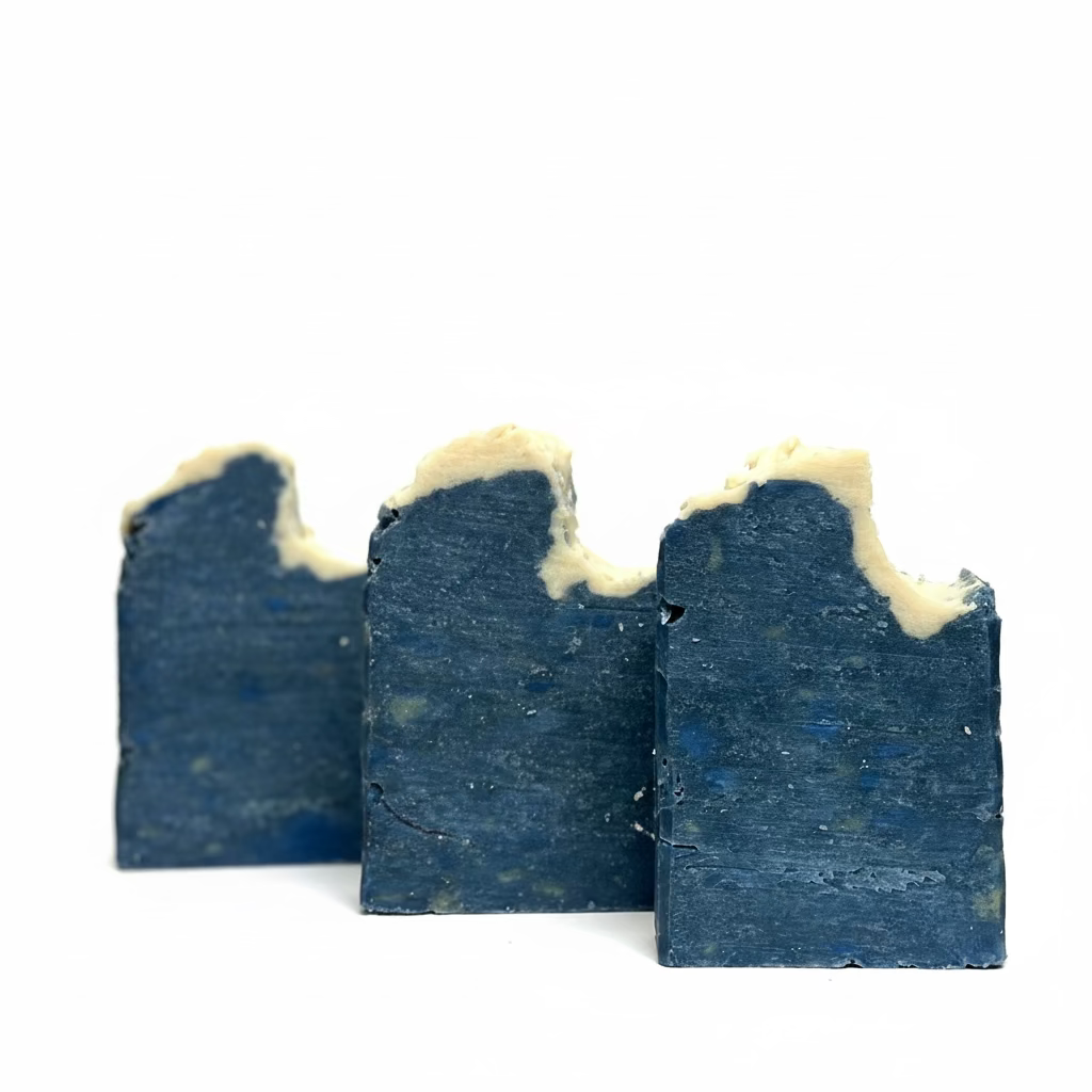 Three bars of blue soap with a white background